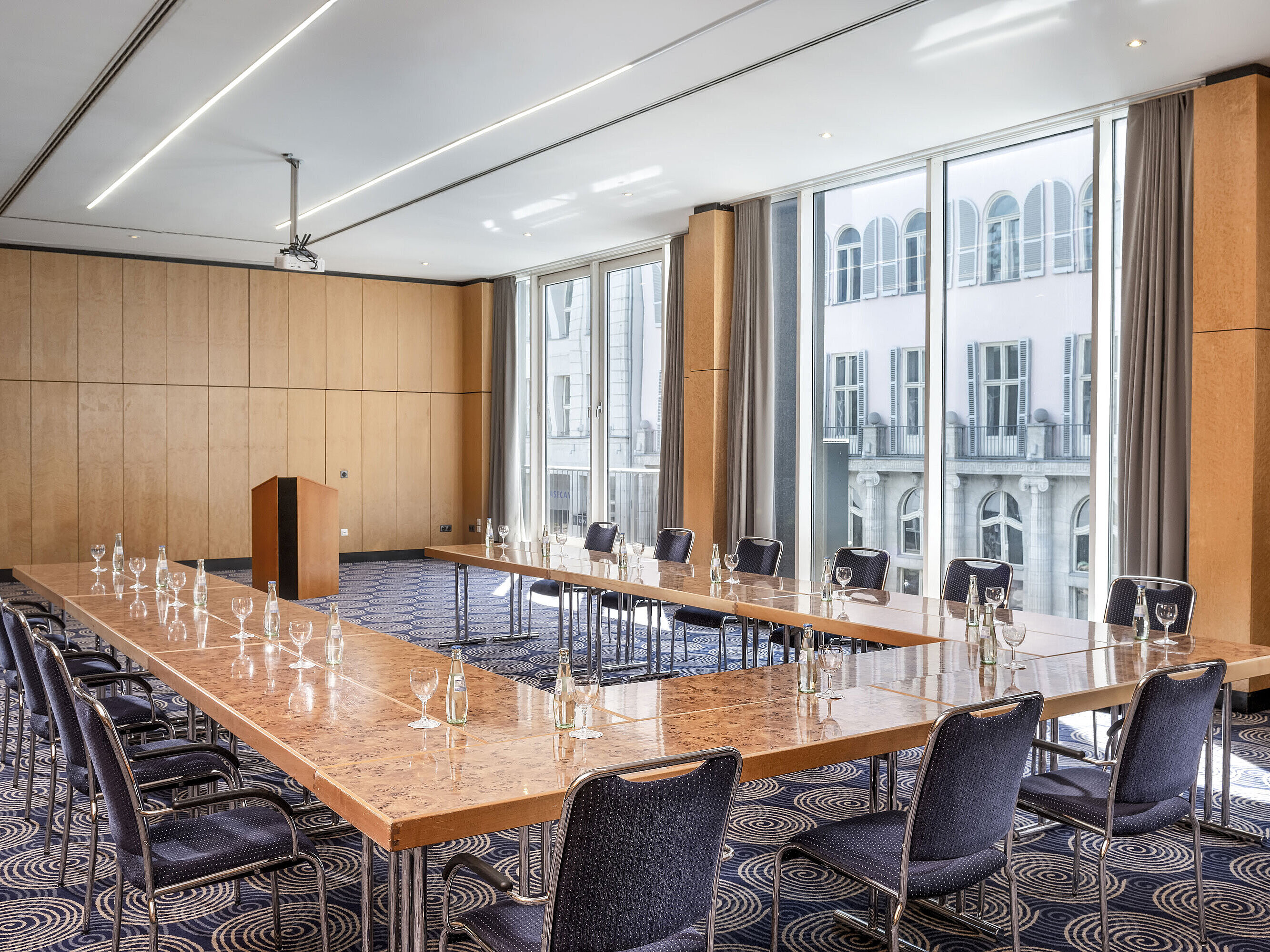 Salon 2 Conference room Salon II at Maritim proArte Hotel Berlin, large U-shaped table with outside view.