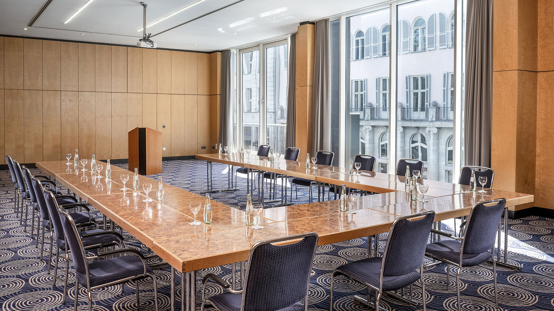 Salon 2 Conference room Salon II at Maritim proArte Hotel Berlin, large U-shaped table with outside view.