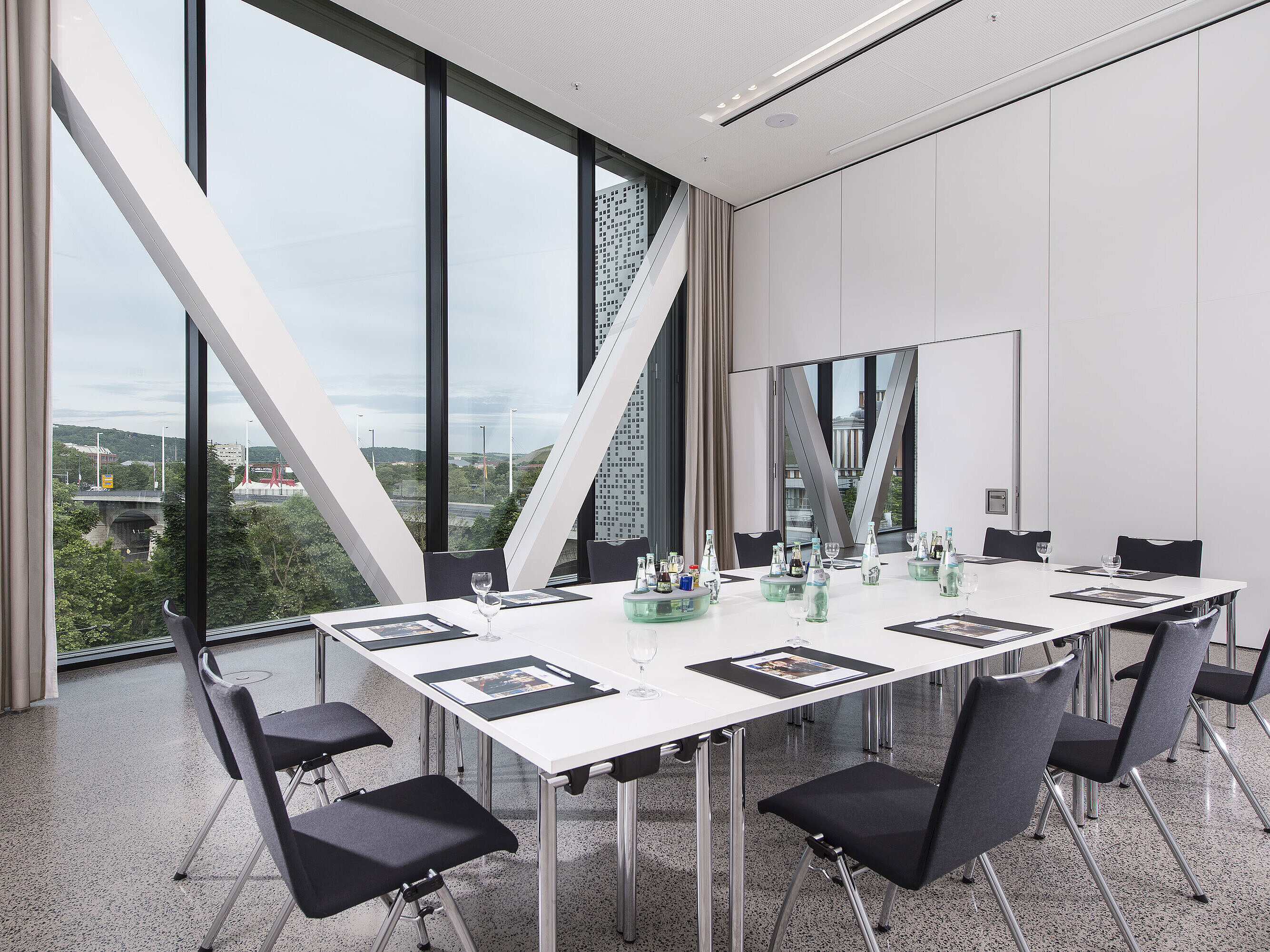 Conference room 10 Bright meeting room at Maritim Hotel Würzburg with large window and view of the Alte Main Bridge