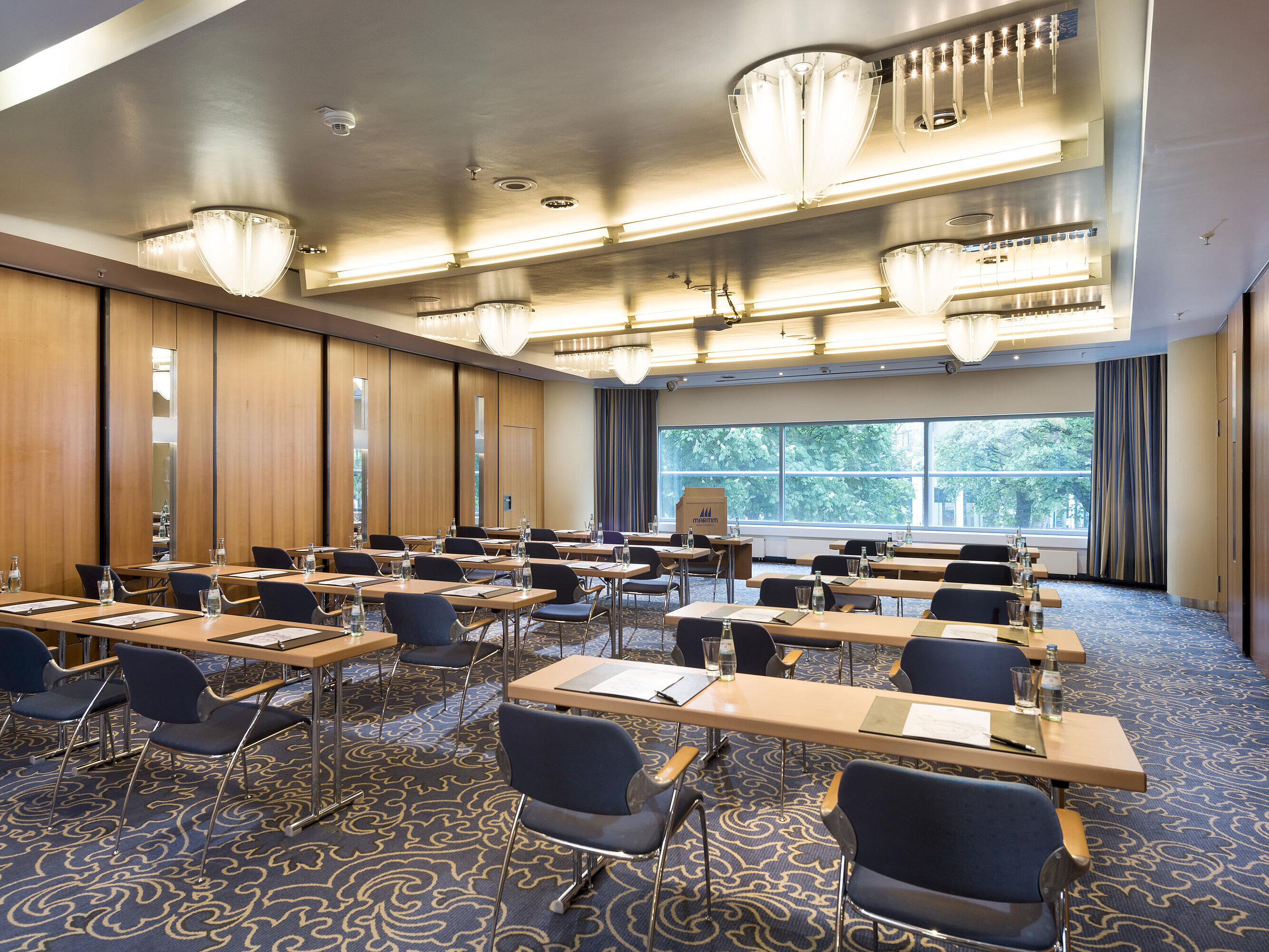 Saal Maritim II Bright conference room at Maritim Hotel Frankfurt with row seating, modern facilities, and large windows overlooking greenery