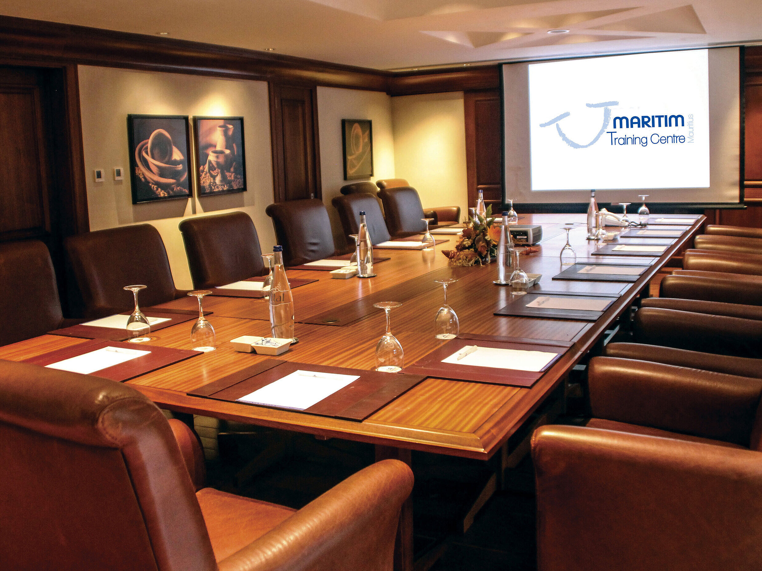Meeting room The meeting room at Maritim Hotel is well-equipped with a large conference table and a projector