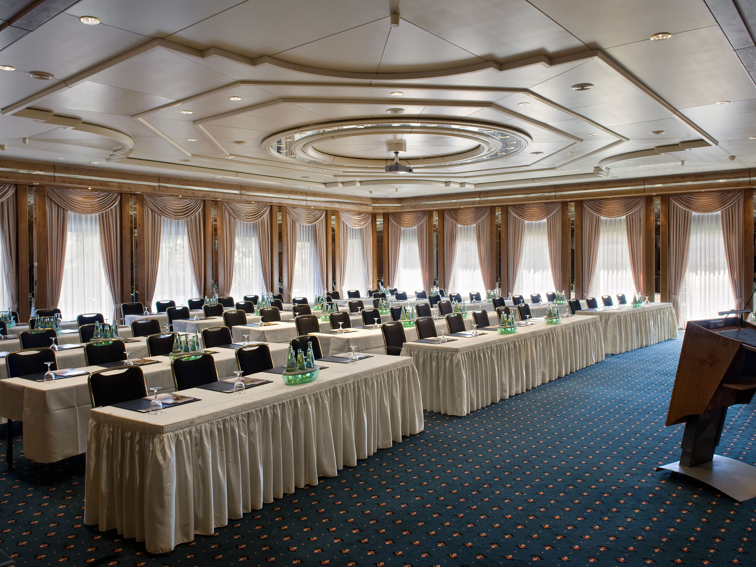 Saal Berlin Conference hall with stage, daylight and modern setup at Maritim Hotel Bad Salzuflen
