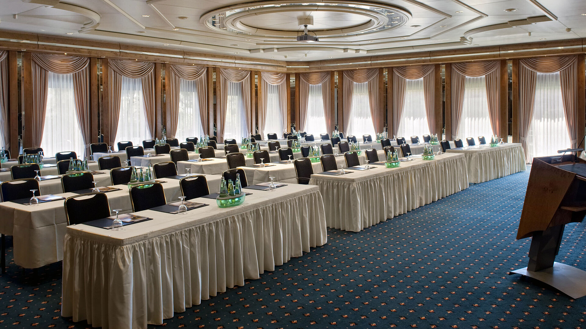 Saal Berlin Conference hall with stage, daylight and modern setup at Maritim Hotel Bad Salzuflen