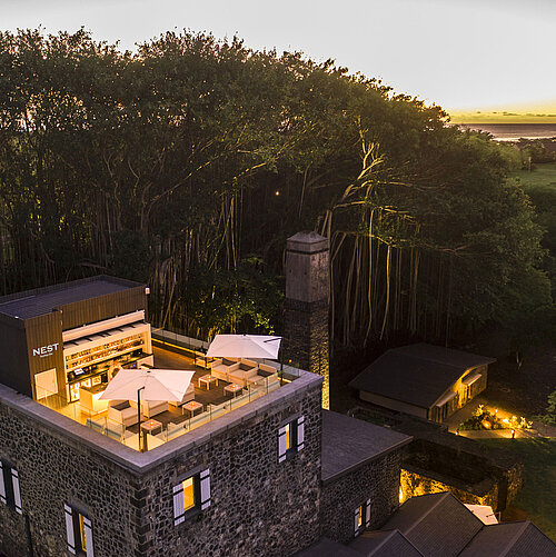 Anno 1743 Restauran A stylish hotel rooftop terrace with comfortable seating and breathtaking sunset views