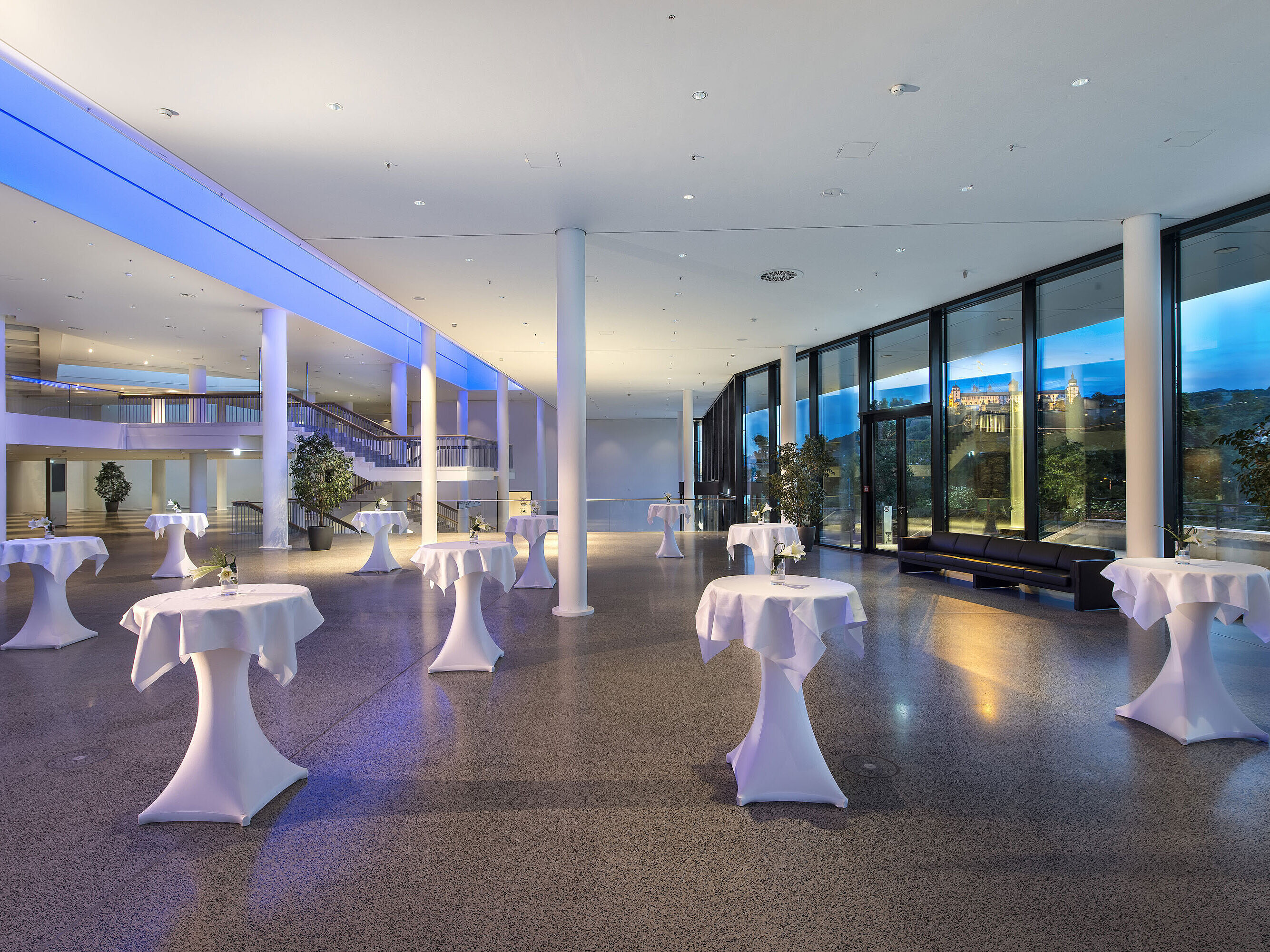 Conference foyer Modern foyer at Maritim Hotel Würzburg with high tables, large windows and fortress view