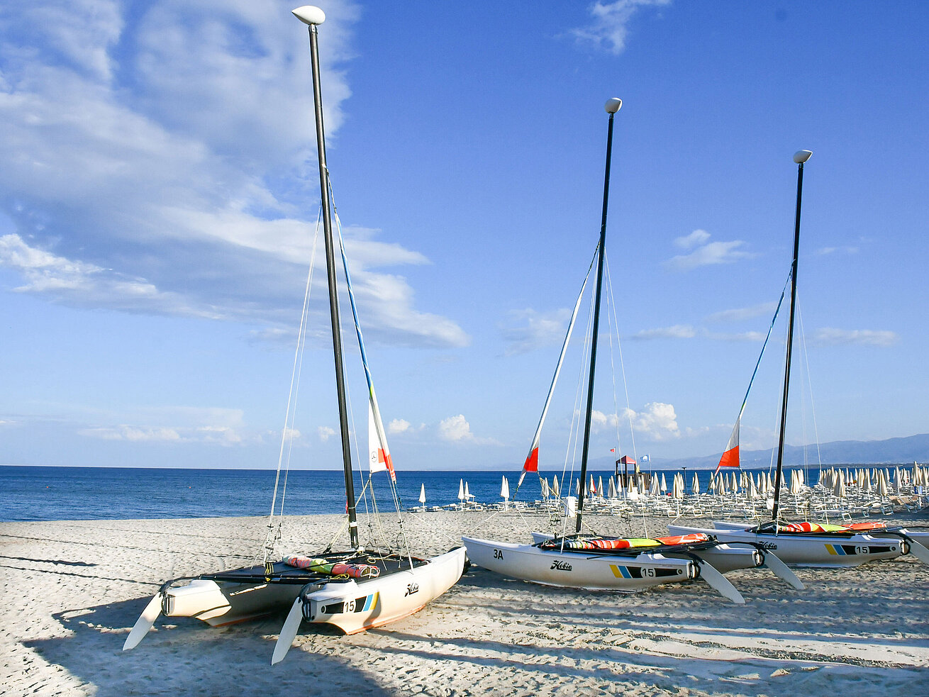 Sailing Catamarans on the beach of Maritim Resort Calabria with sea view
