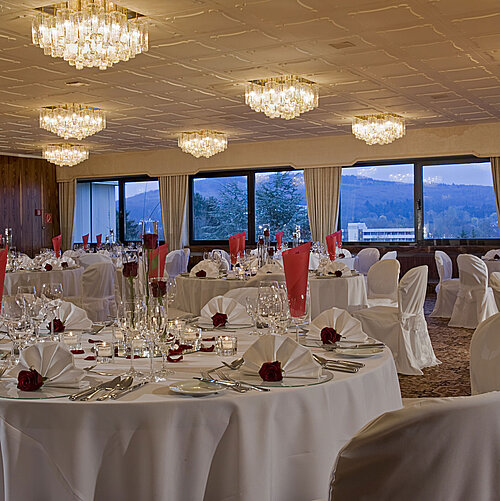 Dachgarten Spacious banquet hall with round tables and elegant decor at Maritim Hotel Bad Salzuflen