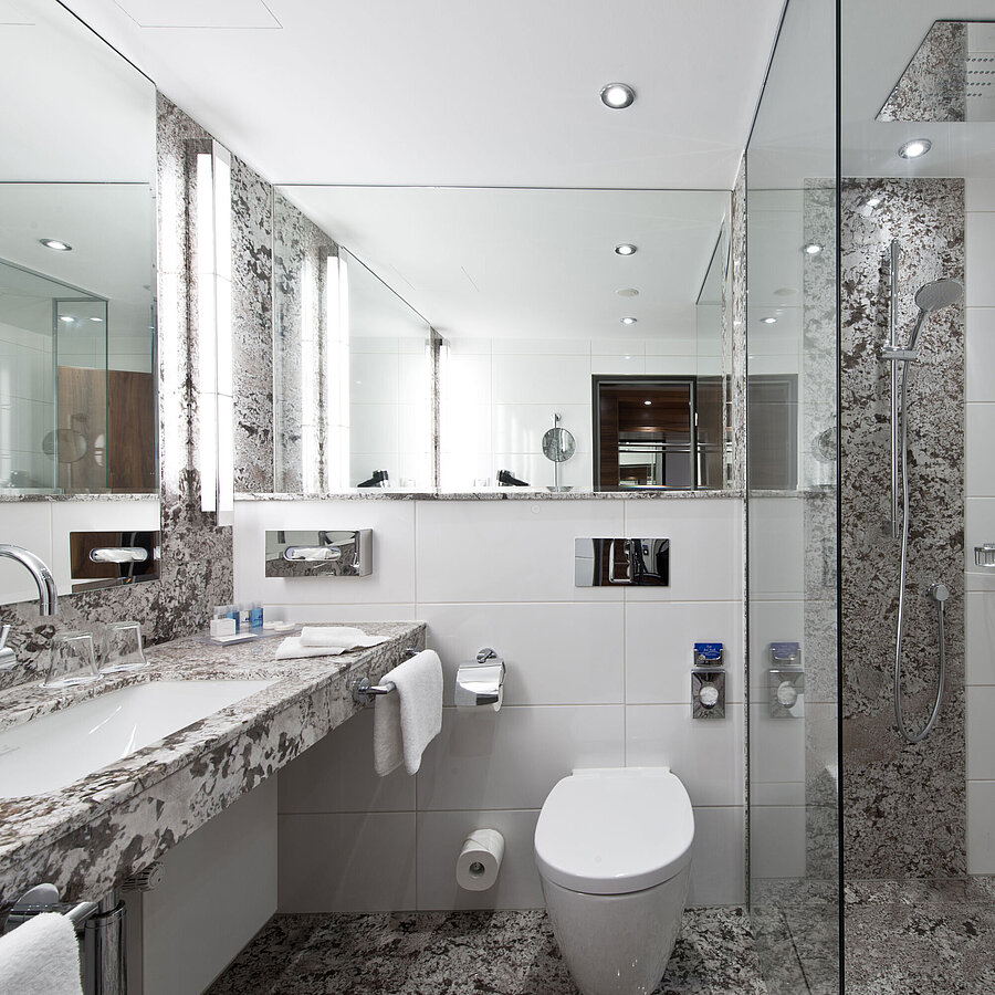 Bathroom Modern bathroom at Maritim Hotel Bad Homburg with elegant rain shower and stylish marble design.