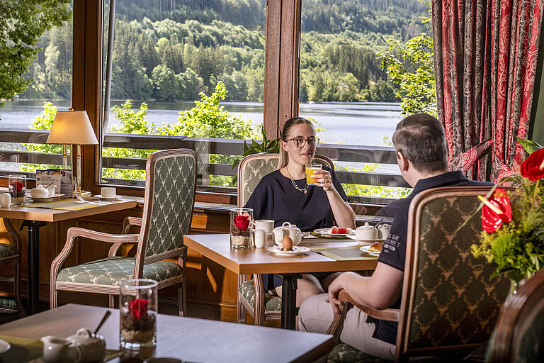 Breakfast Guests enjoying breakfast with lake view at the restaurant of Maritim Hotel Titisee