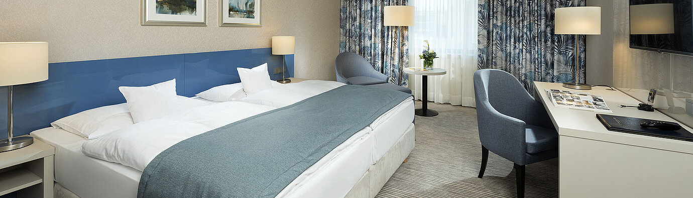 Superior room Superior room at Maritim Hotel Bonn with stylish design, cozy beds, modern desk, and comfortable seating area.