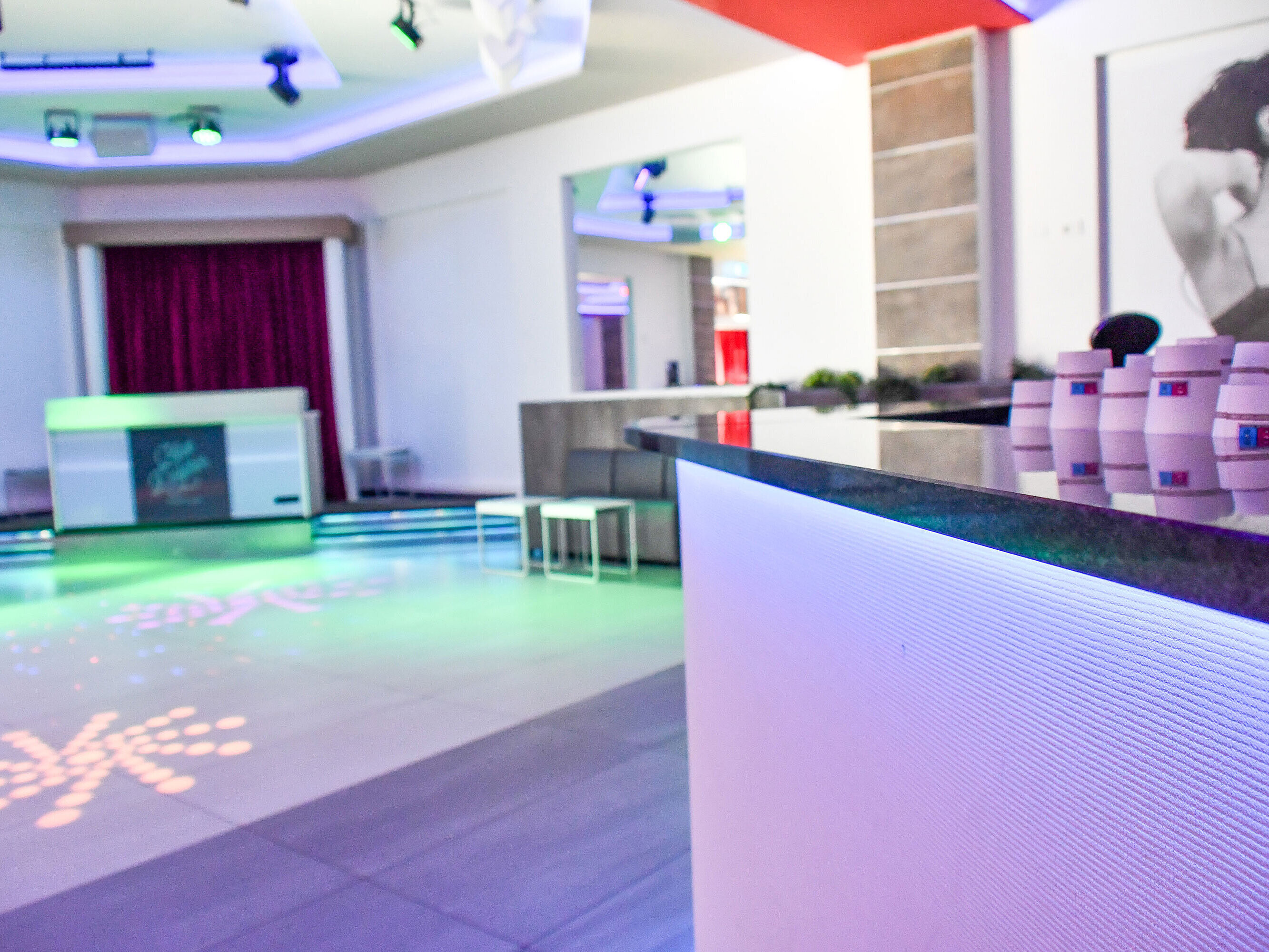 Disco Illuminated bar with stylish counter at the nightlife area of Maritim Resort Calabria