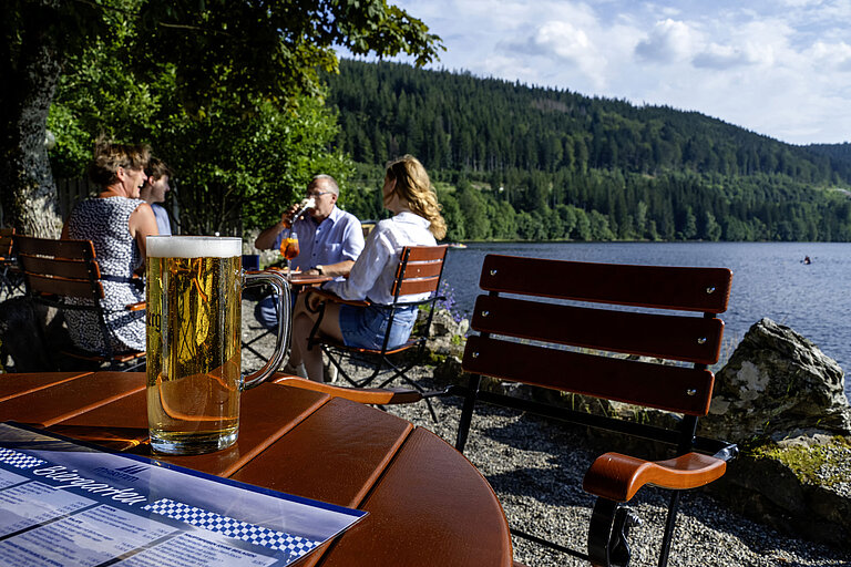 Beer garden Fresh beer on the table in the beer garden of Maritim Hotel Titisee by the lake shore