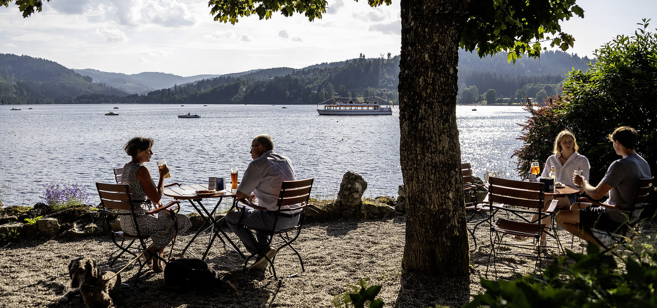 Beer garden Guests relaxing in the beer garden of Maritim Hotel Titisee with lake and mountain view
