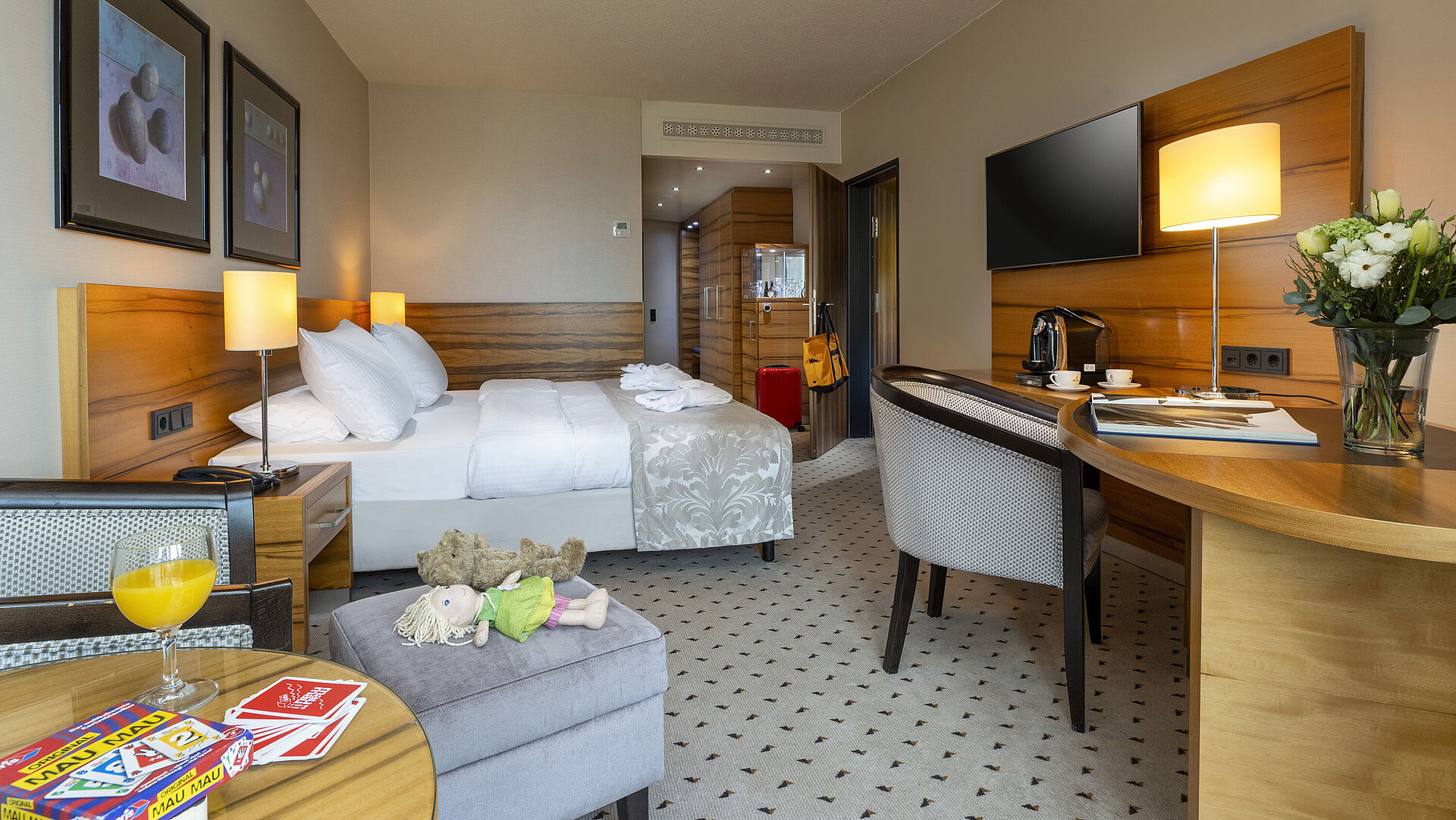 Superior Family room Comfort room at Maritim Hotel Bad Homburg with double bed, toys, teddy bear, and modern wood decor.