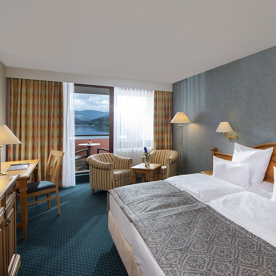 Superior room Spacious room at Maritim TitiseeHotel with seating area and view of Lake Titisee